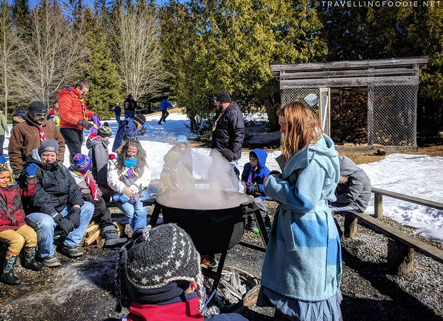 Ganaraska Maple Fest Group of kids around maple syrup kettle with educator