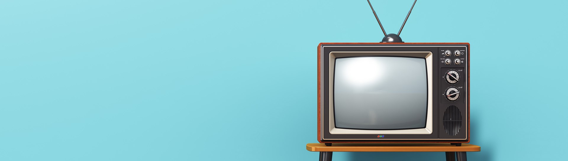 Vintage television on wood floor and blue background
